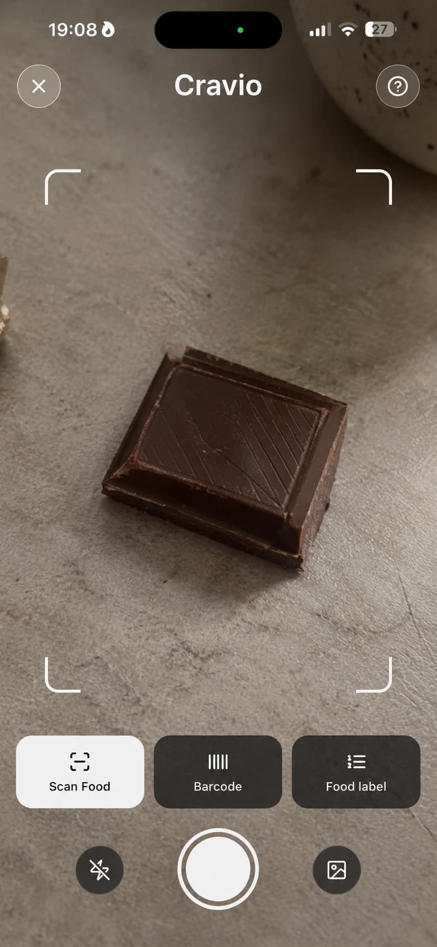 Cravio Sugar Scan camera pointed at a piece of chocolate with Scan Food, Barcode and Food label modes